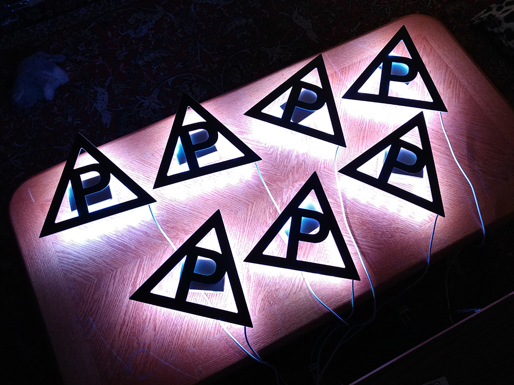 Backlit glowing triangles made by Ion Roux